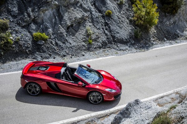 McLaren convertible on a mountain road