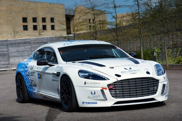 White Aston Martin with black wheels