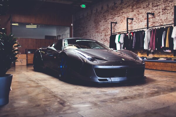 Black Ferrari F50 is located in the middle of a huge huge brick barn