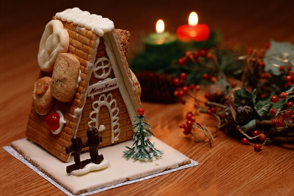 Christmas decorations candles and a toy house