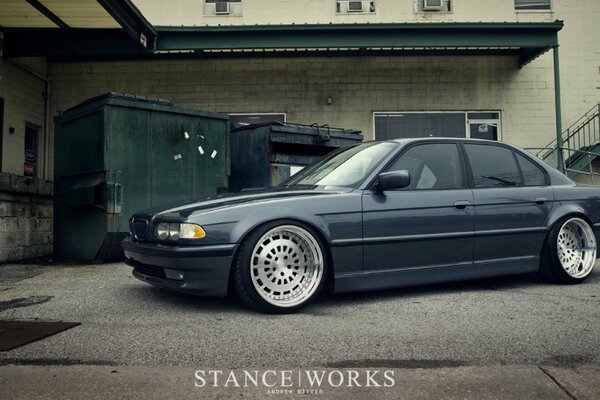 Grey BMW 7-series car in the yard