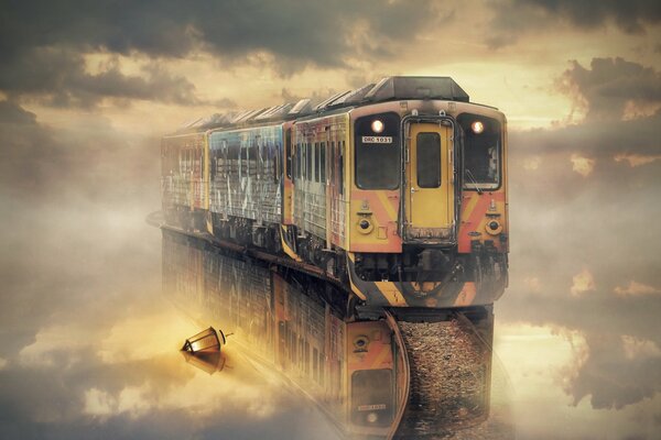 A multicolored train leaves the fog