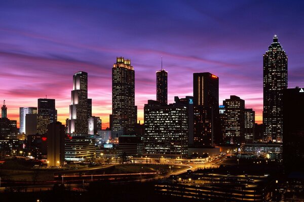 Crimson sunset with a view of skyscrapers