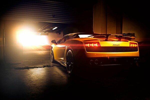 A chic yellow Lamborghini leaves the tunnel