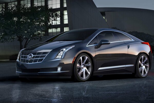 A gray Cadillac reflecting the rays of the departing sun