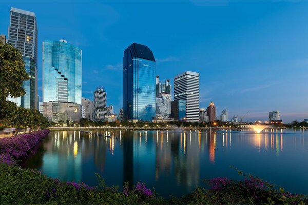 Thailand, twilight, reflection of skyscrapers in the water