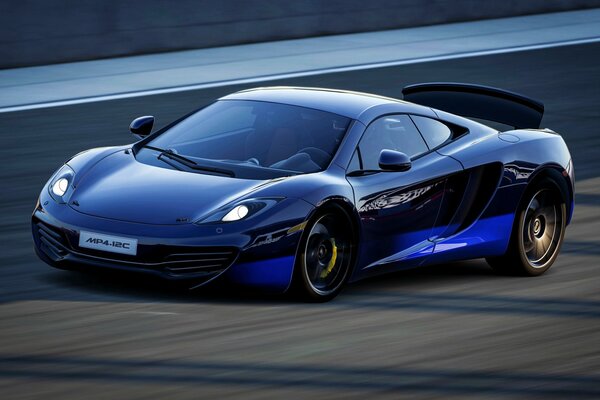 Blue mclaren car, mp4-12c goes at speed