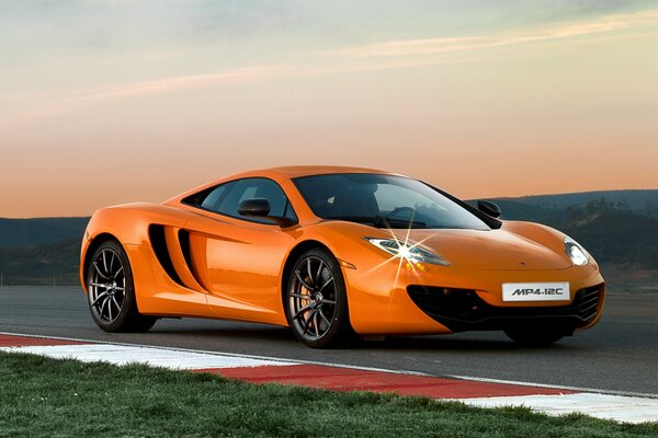 Orange mclaren mp4-12c wallpaper on the track