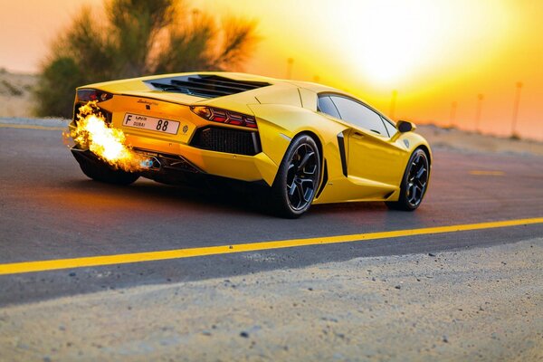 Yellow Lamborghini on sunset background