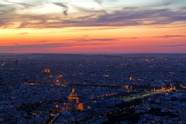 Evening lights of Paris from the height of clouds