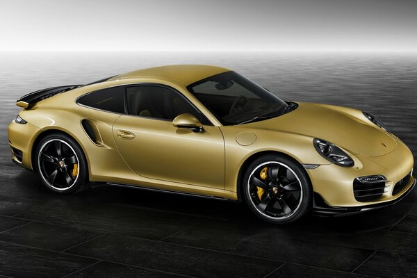 Golden Porsche 911 on a black background