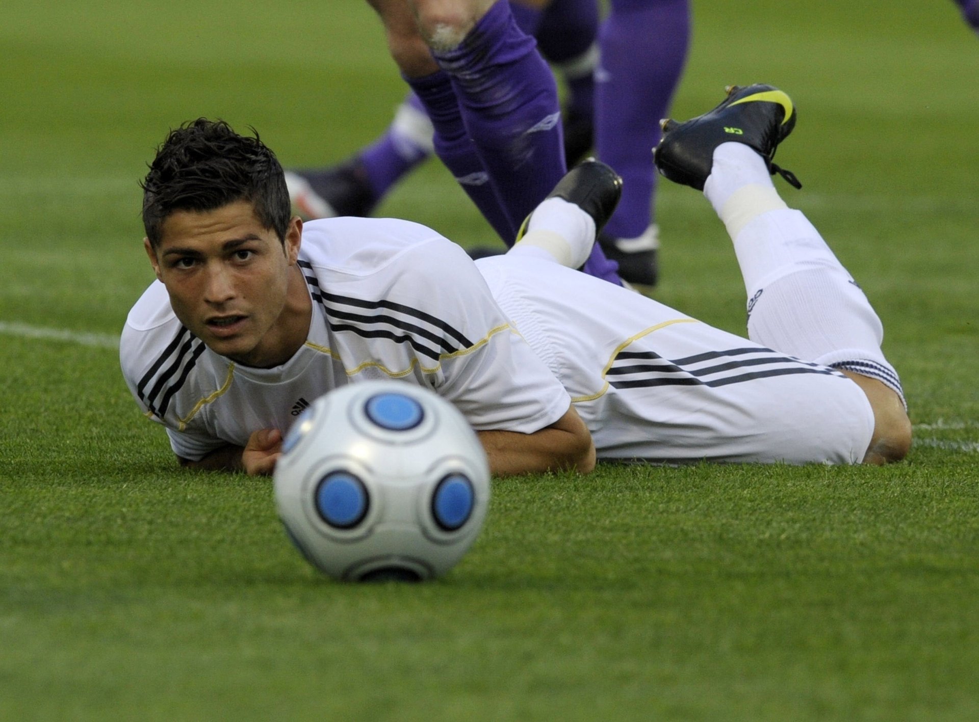 football on the lawn ball ronaldo ronaldo real sport game football player stadium lawn grass lies look brunette men