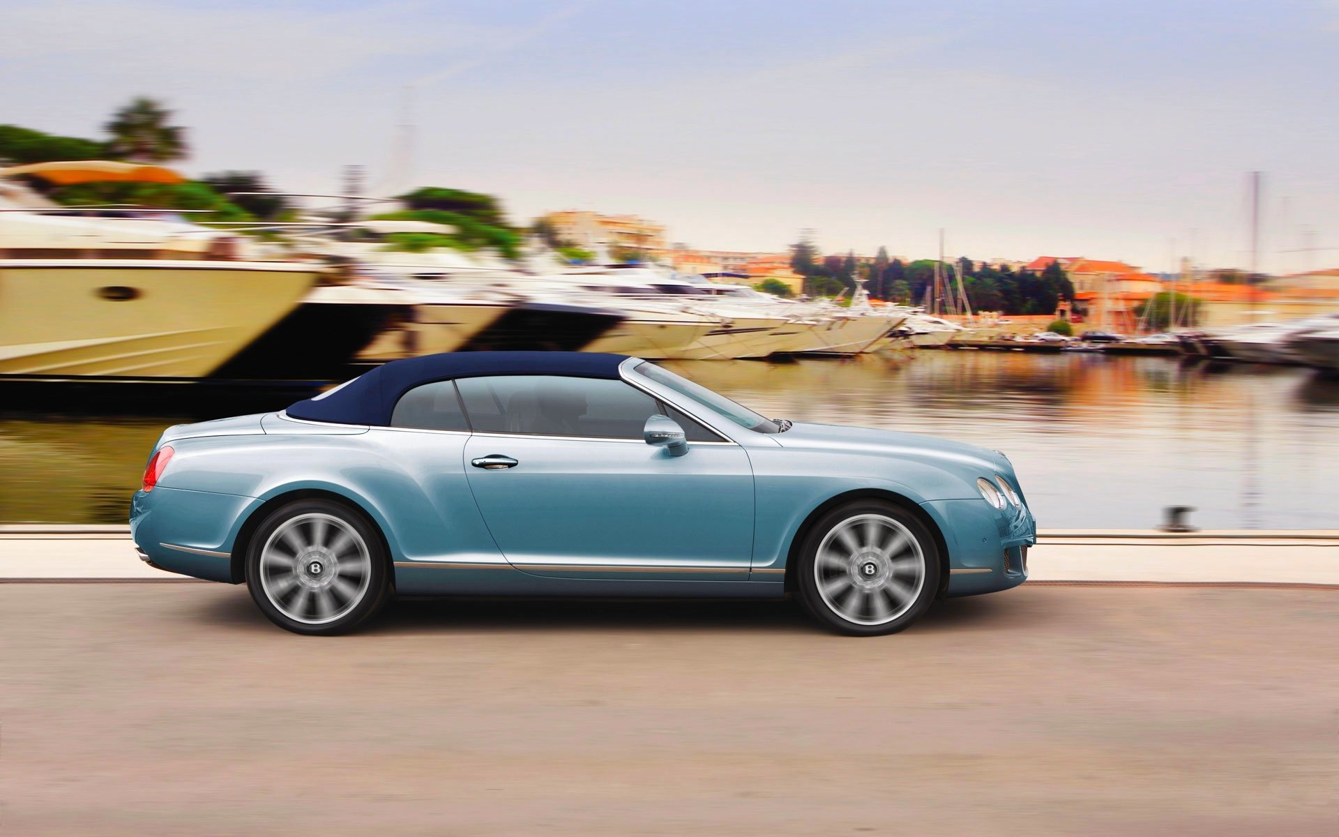 bentley continental gt in motion pier yacht blue