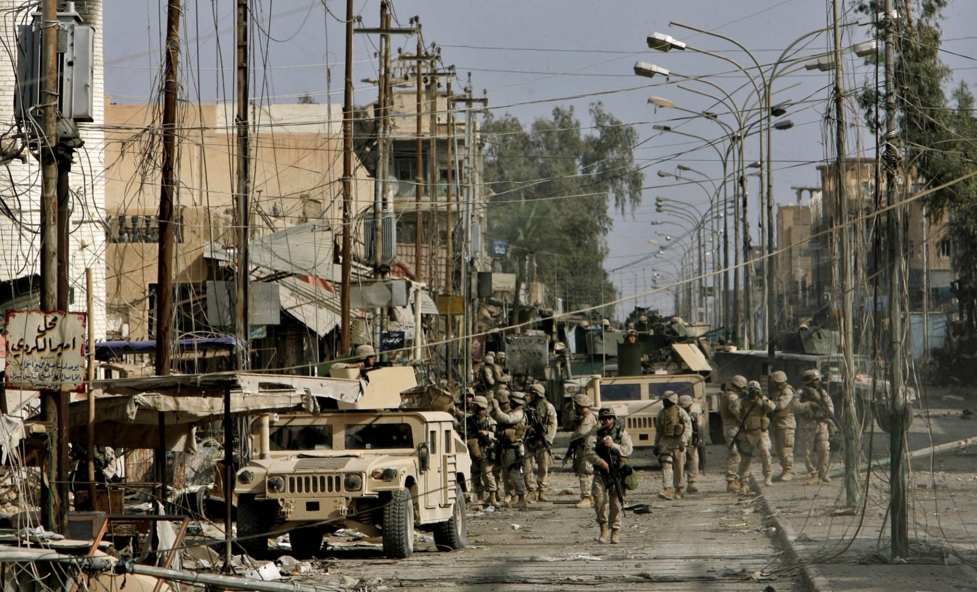 iraq street vehicles men grey war town