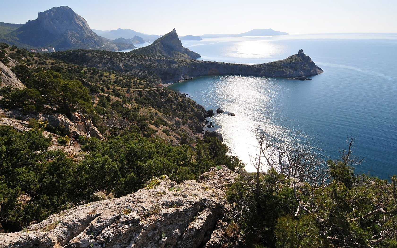 new world crimea mountains bay sea bay landscape nature rocks horizon sun smooth surface beautiful view vegetation cliff water