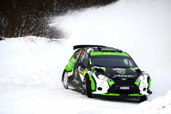 Ford Fiesta on the rally skidded in the snow on the highway
