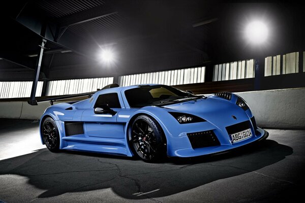 Blue supercar on the night road