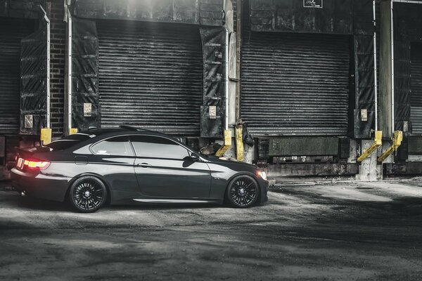 Black sports car in garages