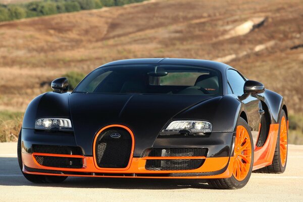 Cherono orange supercar on the background of hills