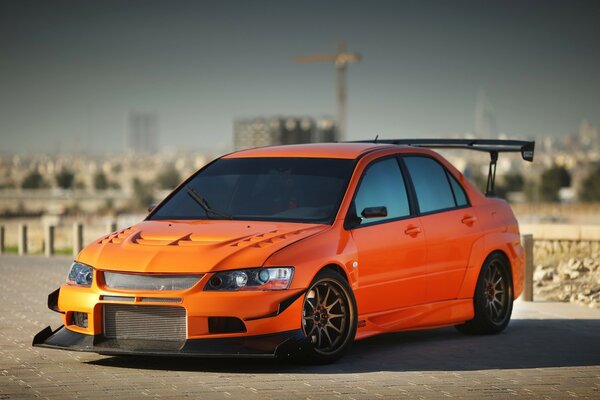 Tuned Mitsubishi Lancer on a city road