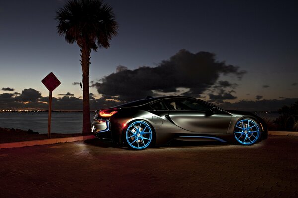 Car on the embankment, illuminated discs