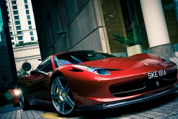 Red Italian sports car Ferrari in the city