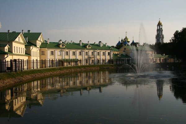 Houses with green lids on the river bank