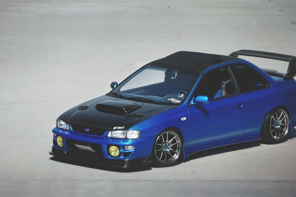 Subaru stands on a gray background