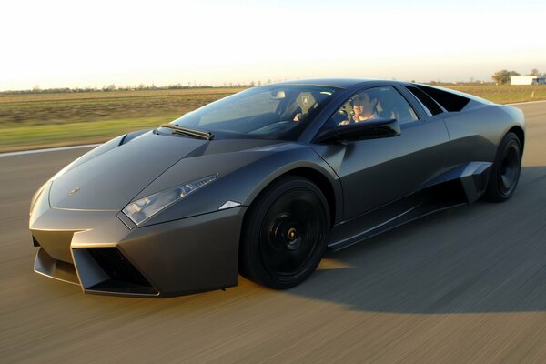 Lamborghini car black on the background of the road