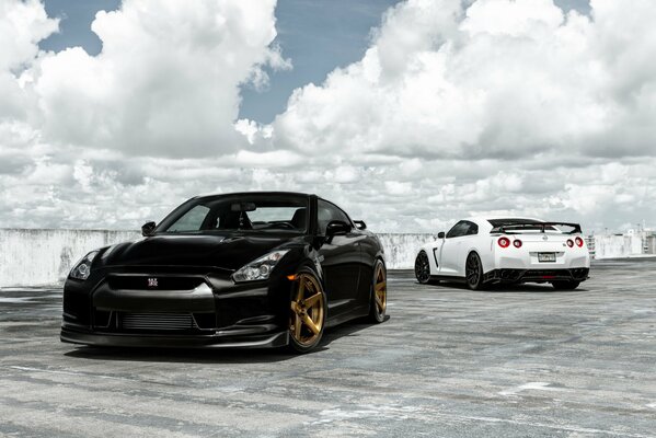 The black and white Nissan are beautifully parked