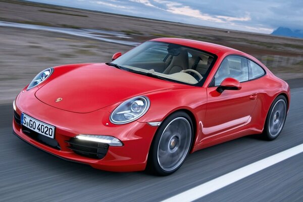 Red sports car on the highway