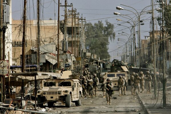Grey city, streets full of soldiers and military vehicles