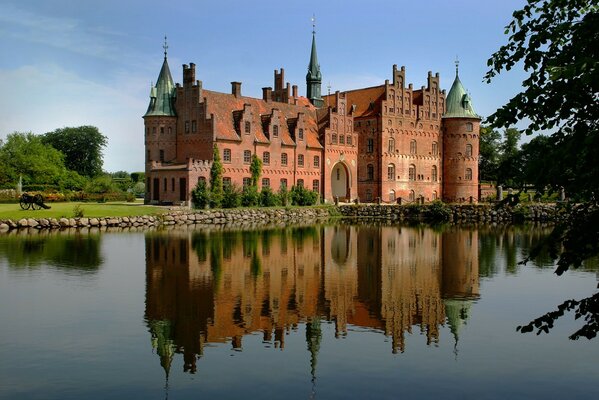 Reflection of the castle on the river bank