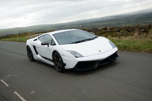 White Lamborghini on the road on a dull day