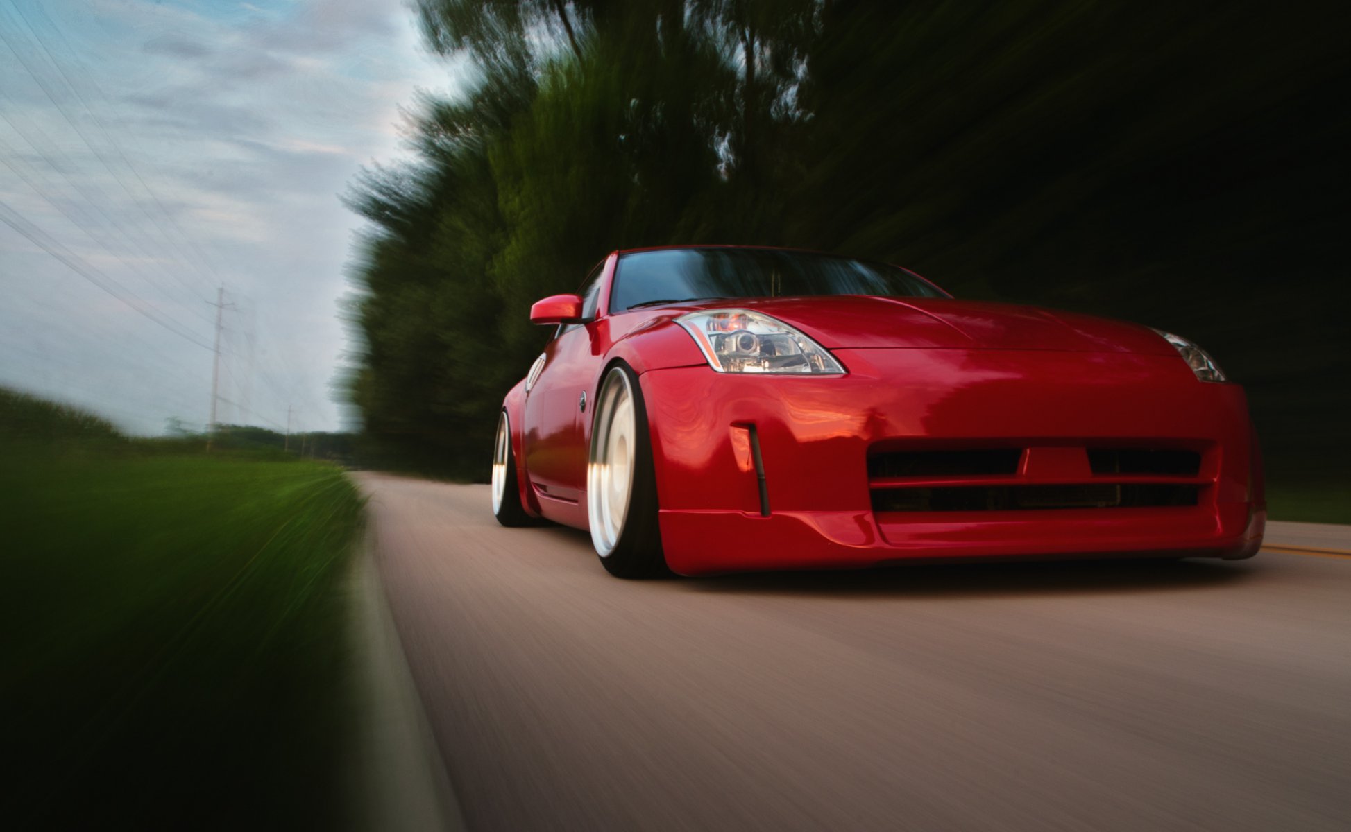 nissan 350z rosso posizione nissan rosso anteriore in movimento