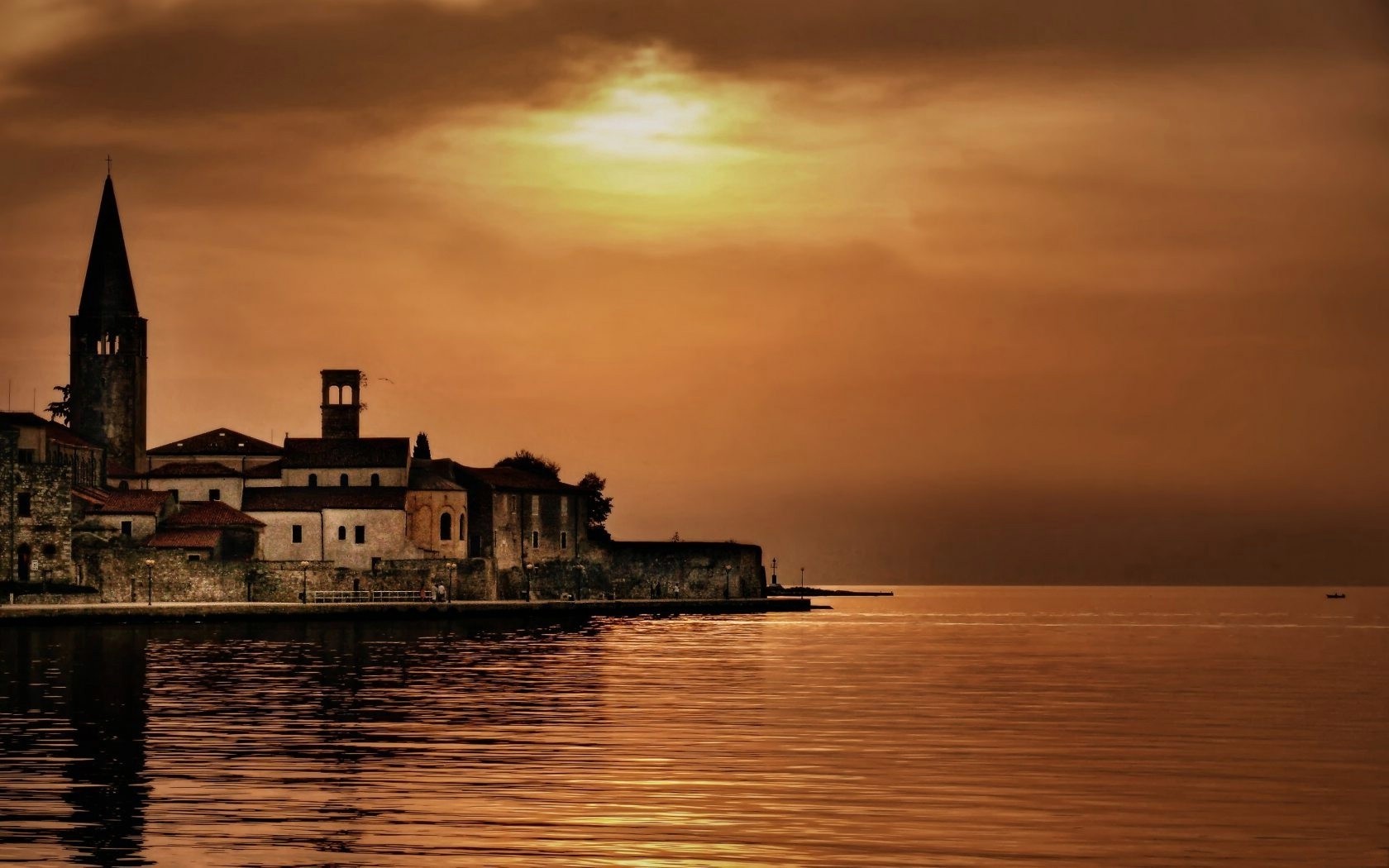 torre puesta de sol agua