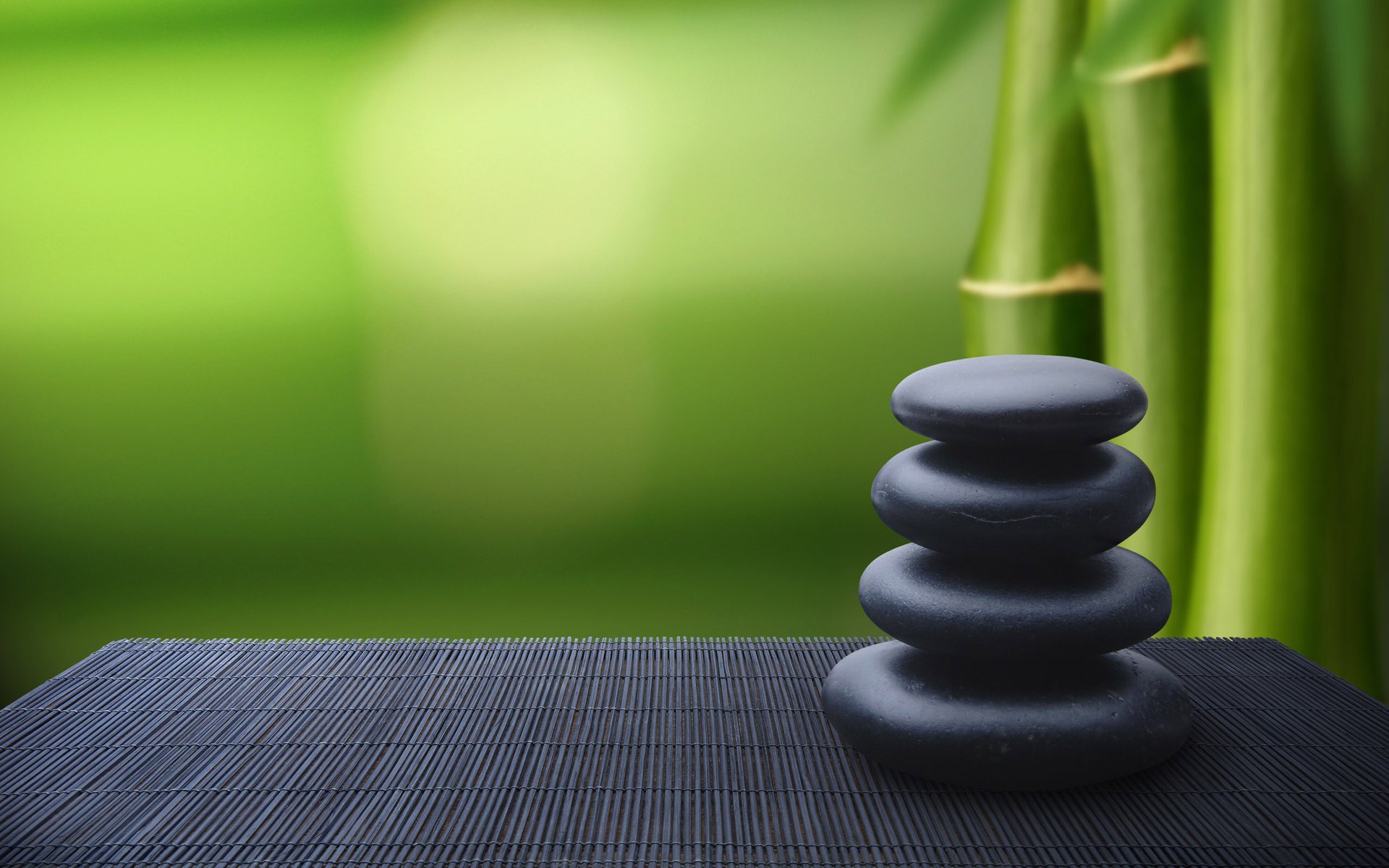 tones pyramid table stack black green background bamboo relax pebble