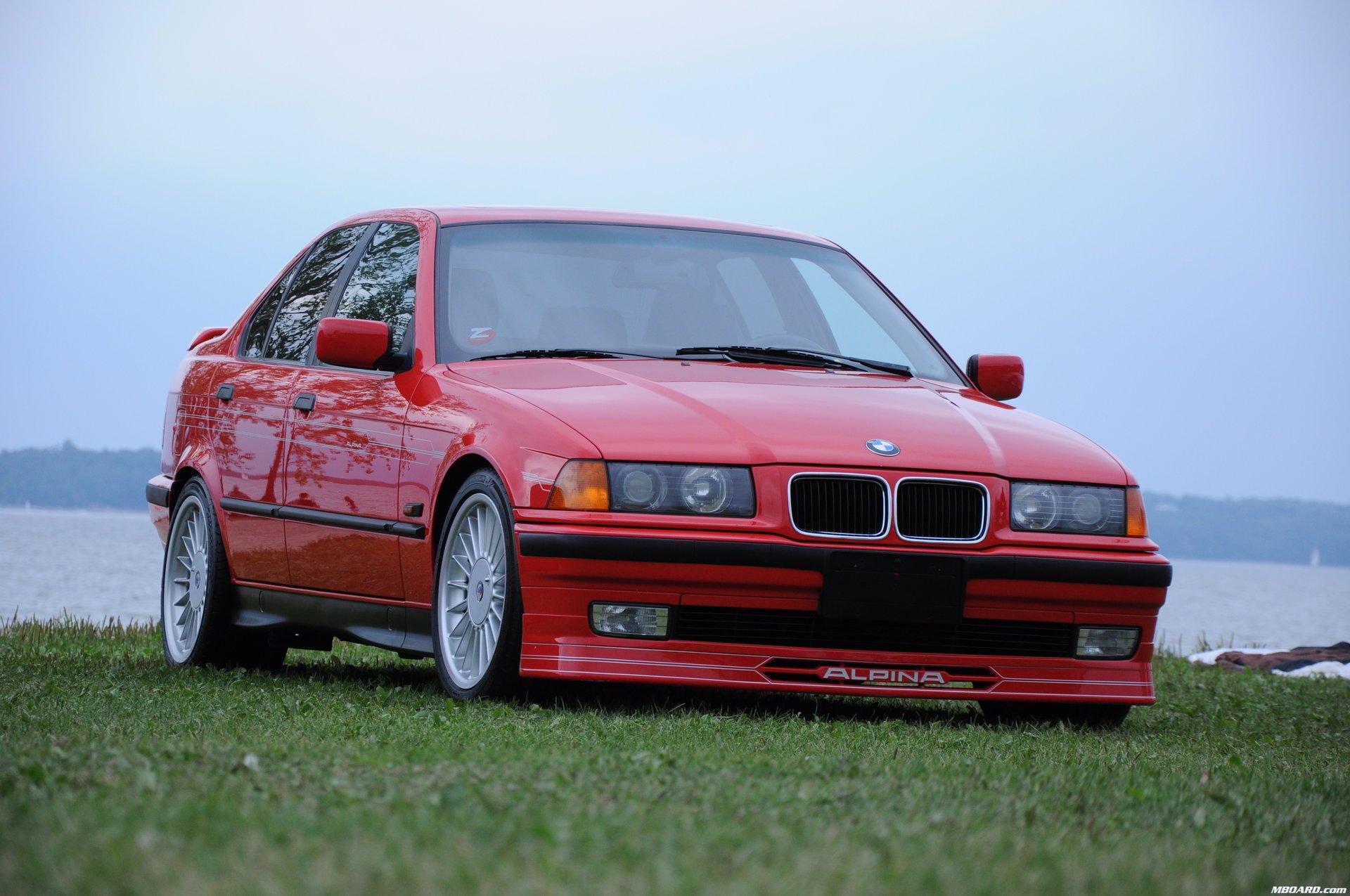 alpina b3 alpina e36 red germany bavaria bmw bmw techno design auto red car car sky car transport grass greenery lawn passenger cars motor transport