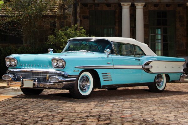 Classic 1958 convertible on a beautiful background