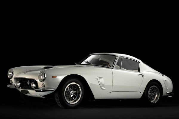 White retro Ferrari car on black background