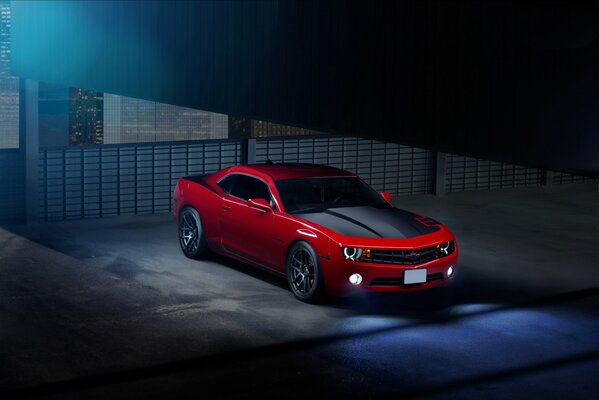 Red Chevrolet at night