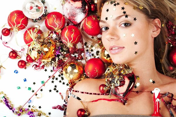 Girl and Christmas decorations. Sequins