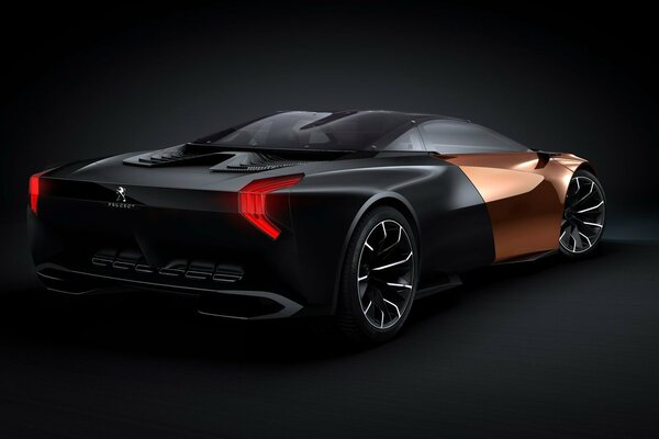 Coche peugeot Onyx negro con oro sobre fondo oscuro