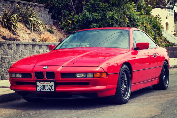 Red retro car on the road