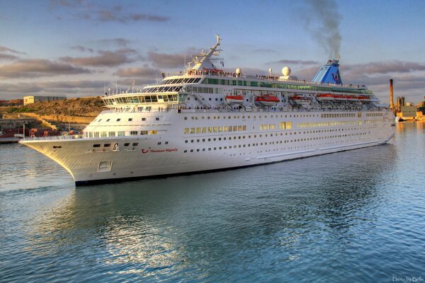 Cruise liner slowly dissects the water surface