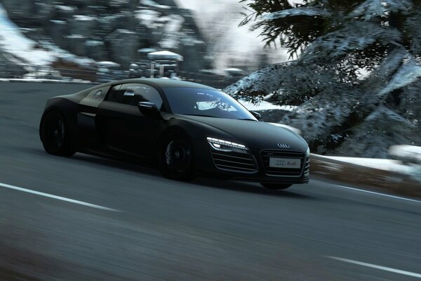 Audi on the highway and the background of a snow-covered forest