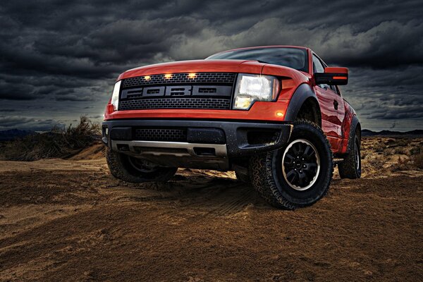 Red Ford against the sky. Bottom view