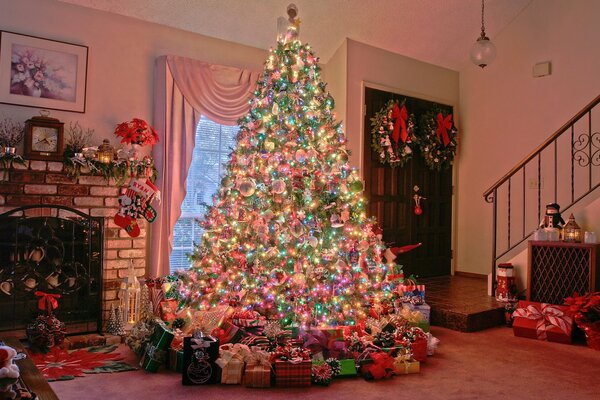 Luxury Christmas tree next to the fireplace