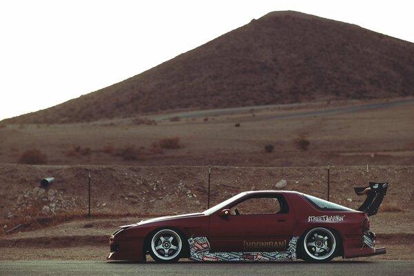 Mazda car on the background of the desert