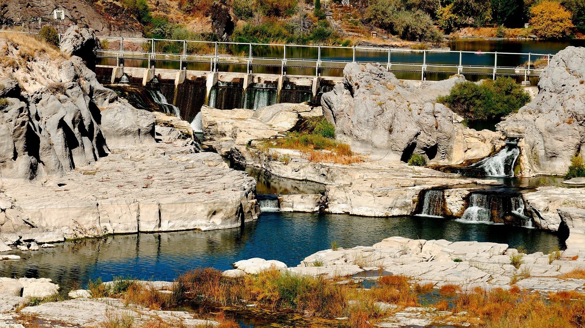 the dam on the river white stone water river shore rock